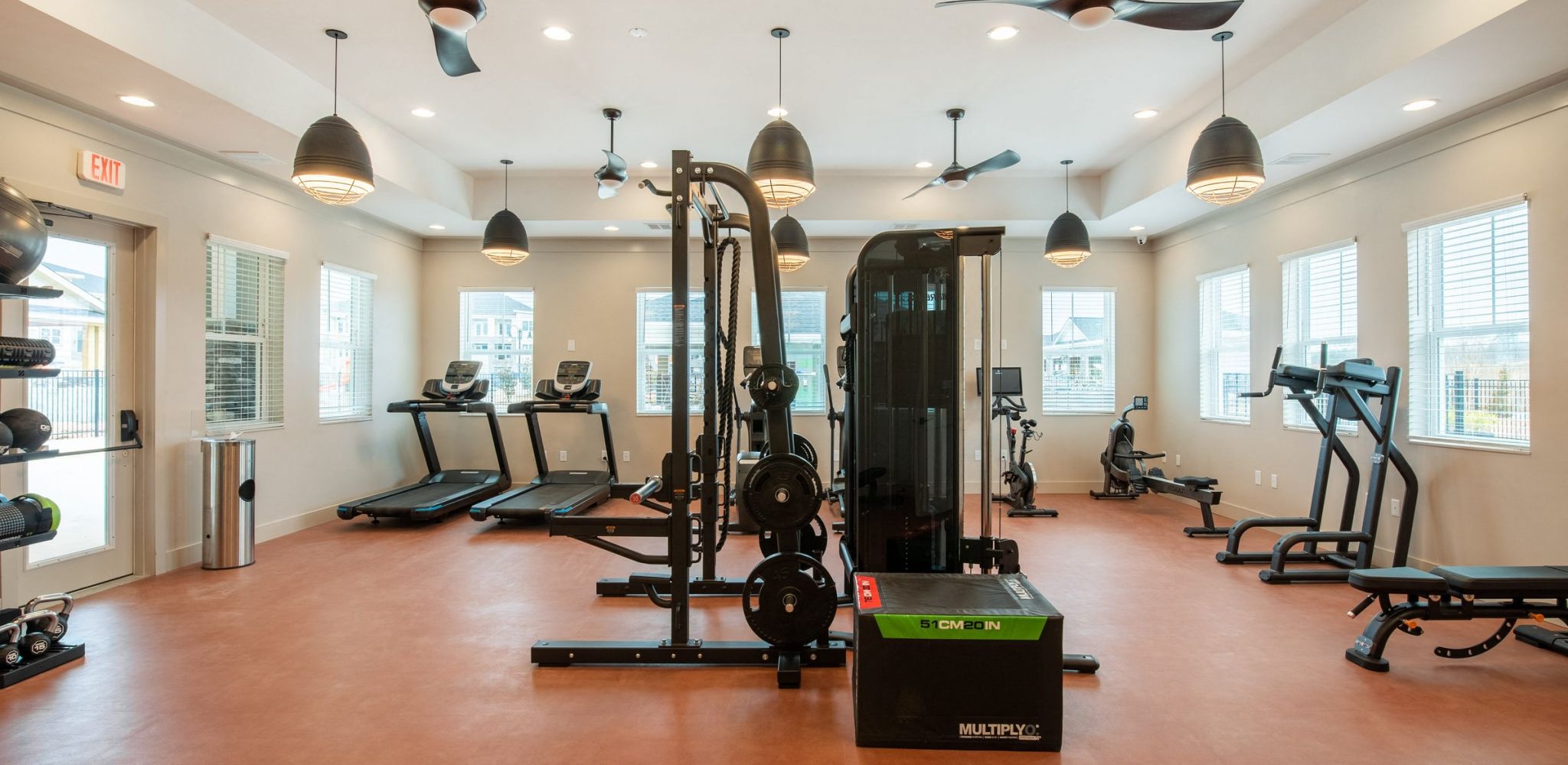Hawthorne at the Crest apartments fitness studio with training equipment and cardio machines