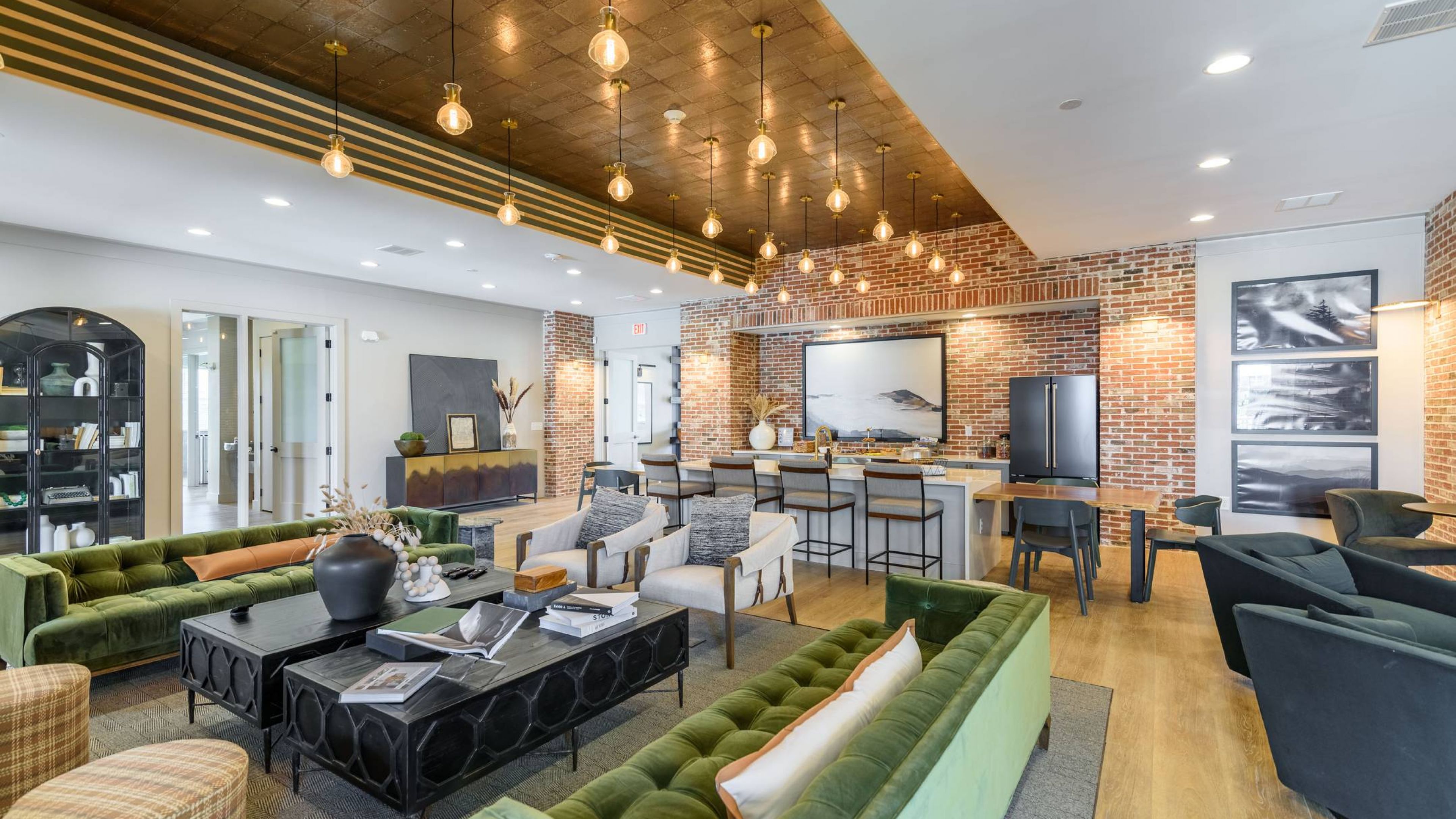 Hawthorne at the Crest outdoor amenity area with fireplace, seating, and large TV