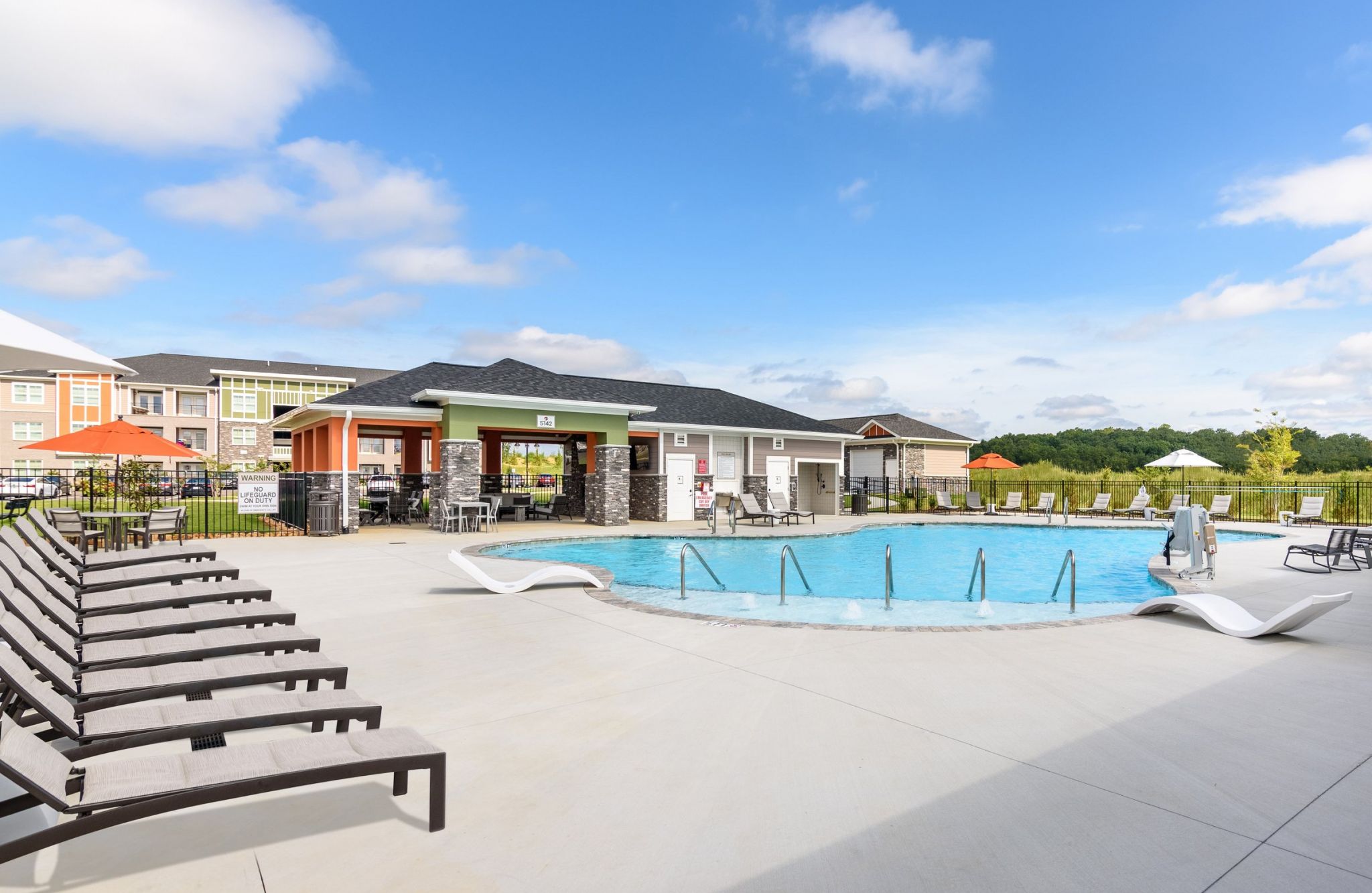 Hawthorne at the Crest outdoor pool with surrounding lounge seating